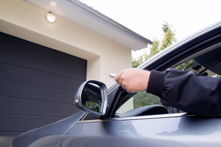 Man using his garage door remote