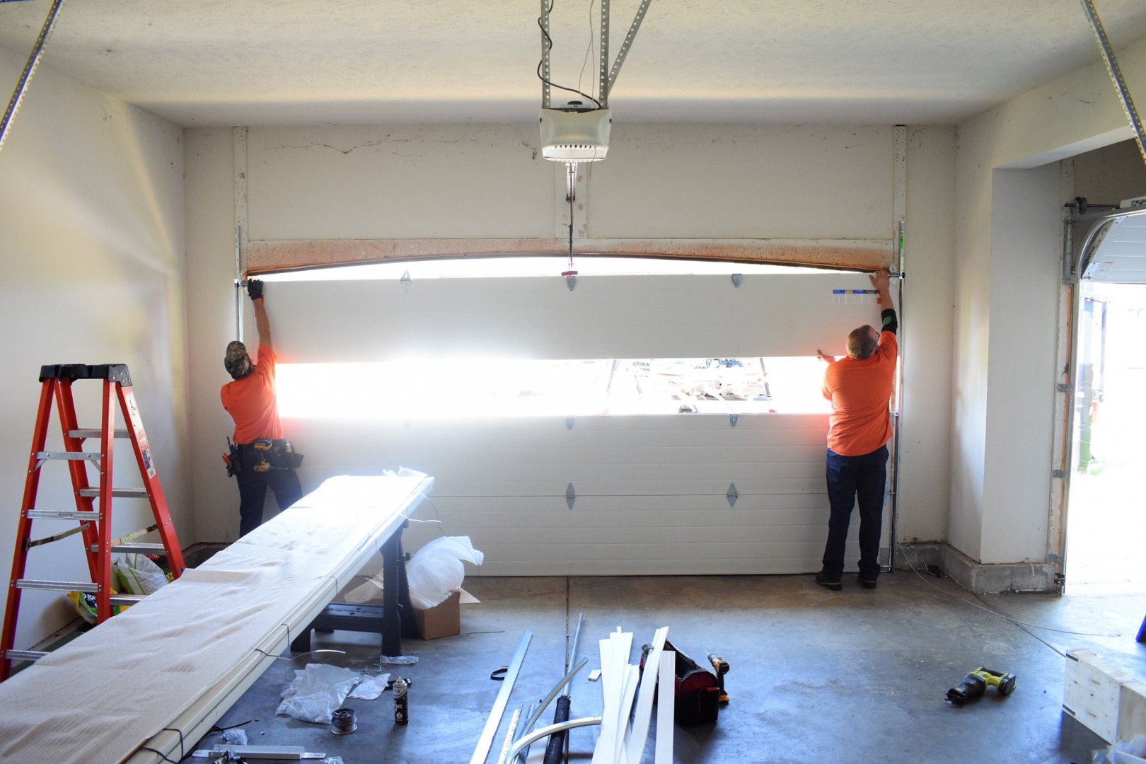 The crew at Garage Door Guy can help you decide whether to repair vs. replace your garage door like they did this homeowner